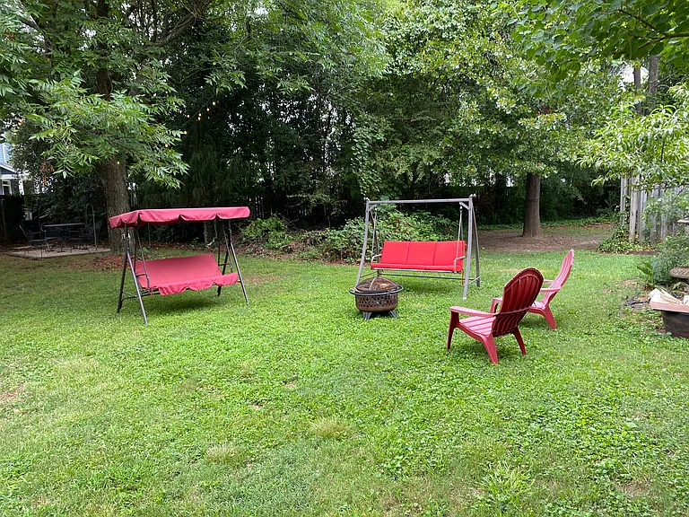 The backyard use of furniture and a fire pit is included with the unit