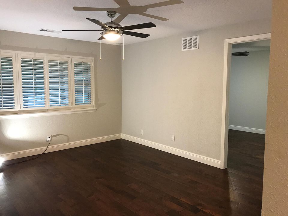 The bright, large living area is entered off the common fro