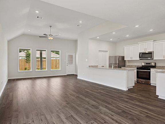 The beautiful windows in the family room overlooks the backyard