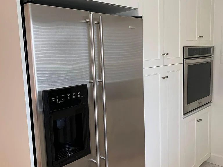 Wall oven, custom cabinetry, stainless refrigerator/freezer