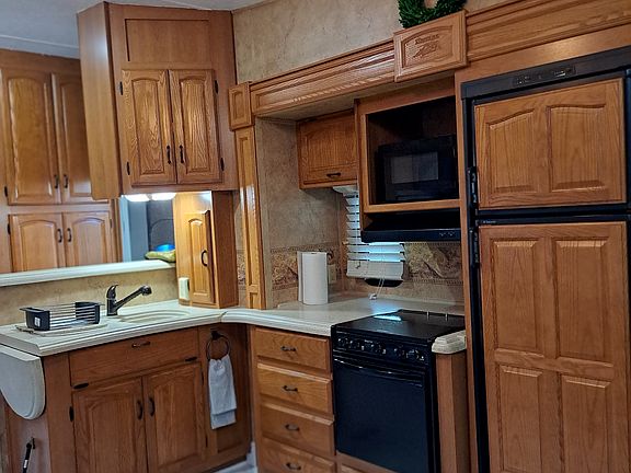 Food preparing area. Stove and Refrigerator.