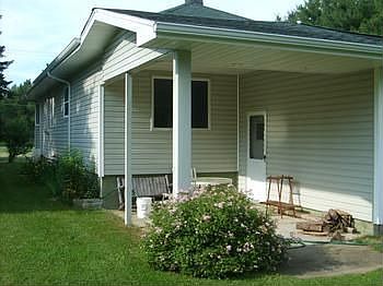 Back view of home, sit out here and have lunch on a nice summer day and enjoy the beautiful back yard.