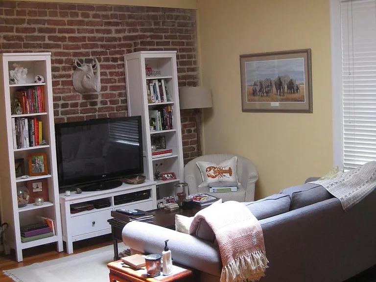 Living Room with exposed brick