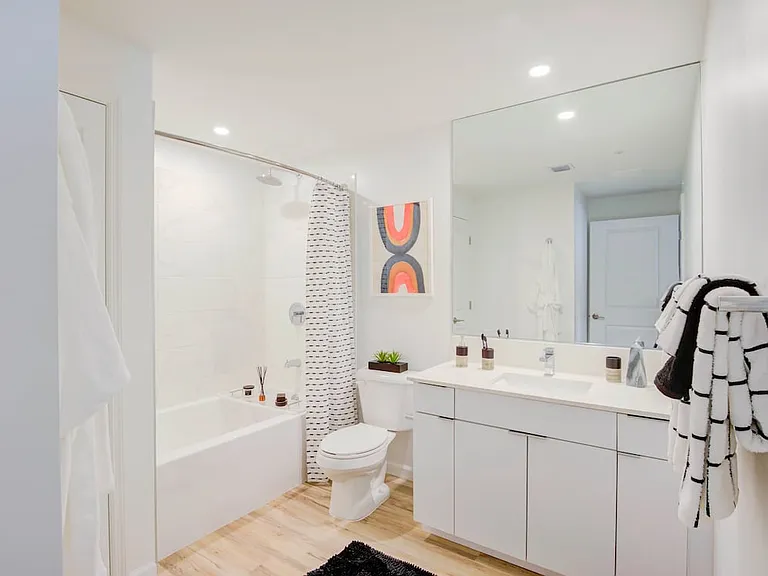 East Phase Bath with white cabinetry, white countertop, and hard surface flooring