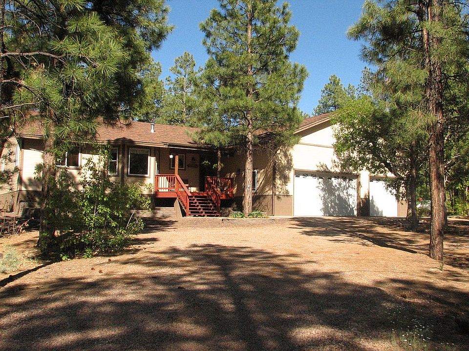 EMACULATE 2300 foot home on1.23 acres of tall pines 