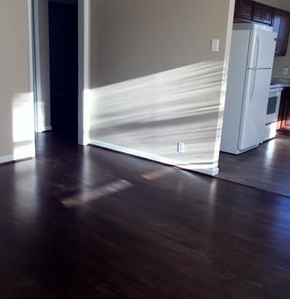 Living room toward the kitchen and bedrooms