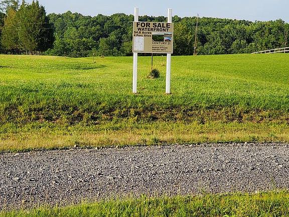 billboard sign at entry gate & drive/walk trail