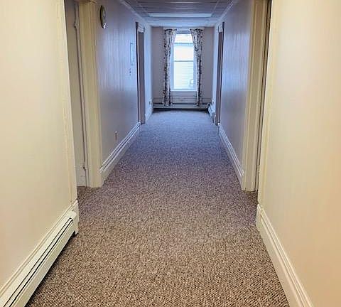 Interior hallway dividing the apartment left to right