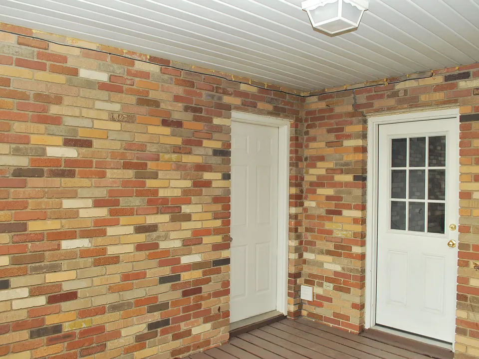Balcony to kitchen and garage doors