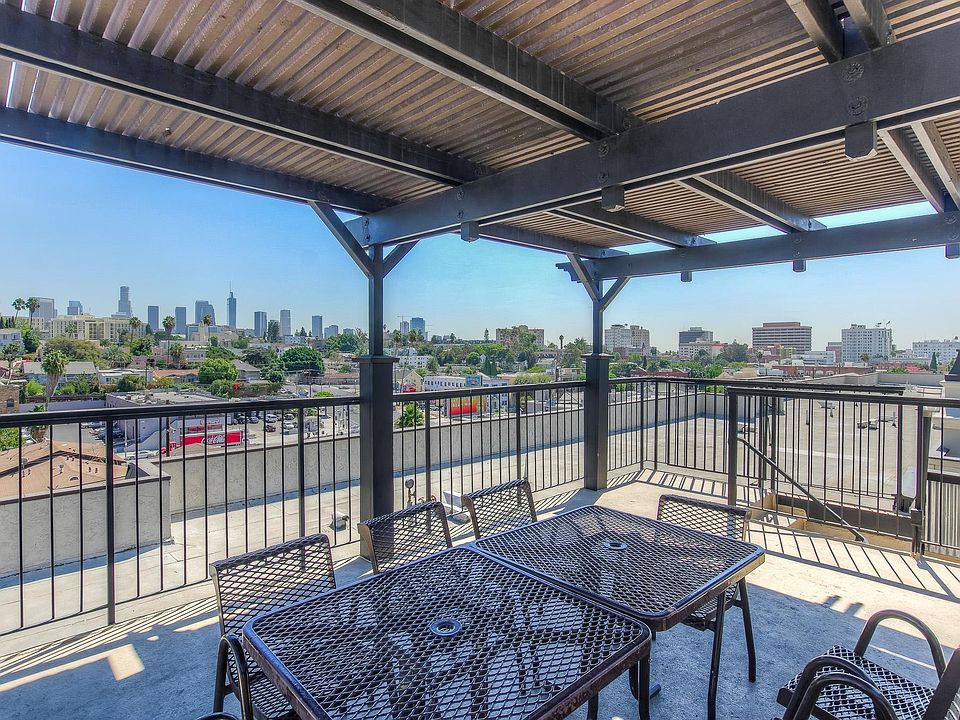 Rooftop dining area near BBQ.