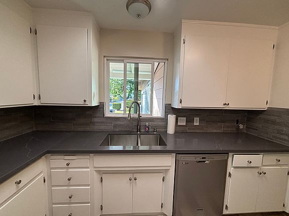 Kitchen - New counters and backsplash. Newly painted cabinets