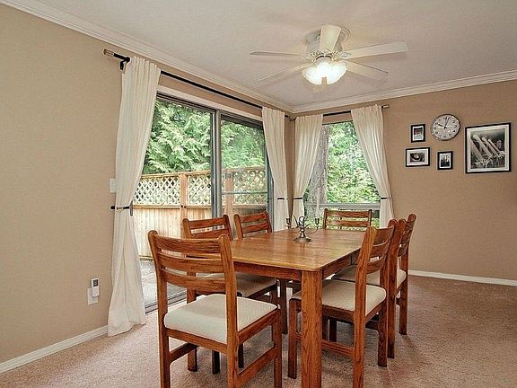 The large dining room suited for extended seating and a China hutch, also enjoys territorial views o