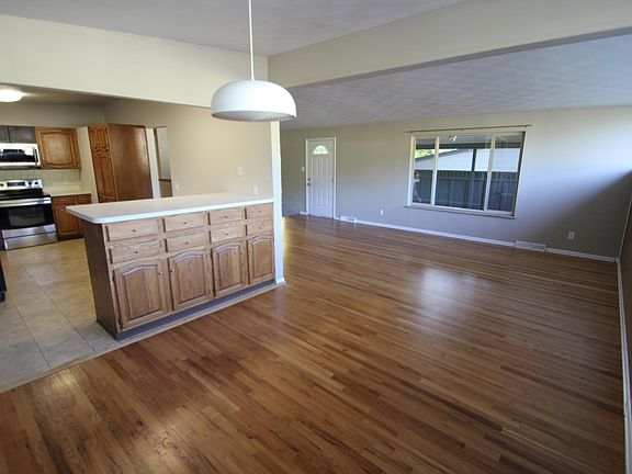 Kitchen, Dining and Main Room (covered patio through window)