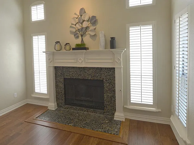 One of 2 wood burning fireplaces with gas starters