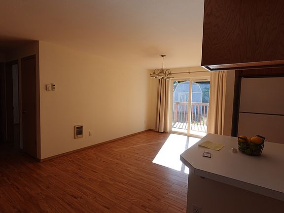 Dining area with slider to back deck and back yard. There's a storage building with electricity.
