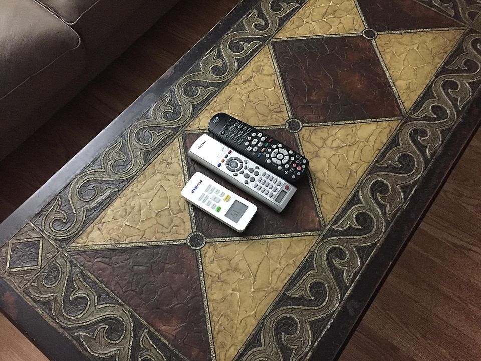 Coffee table with remotes for TV and HVAC