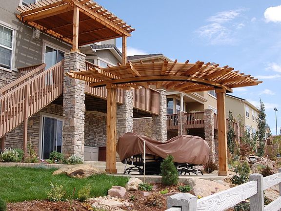 2 pergolas on back of home