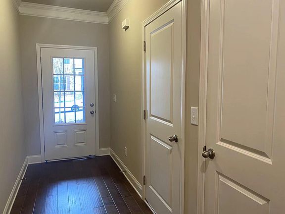 Porch. The right side doors open to the garage and a closet.