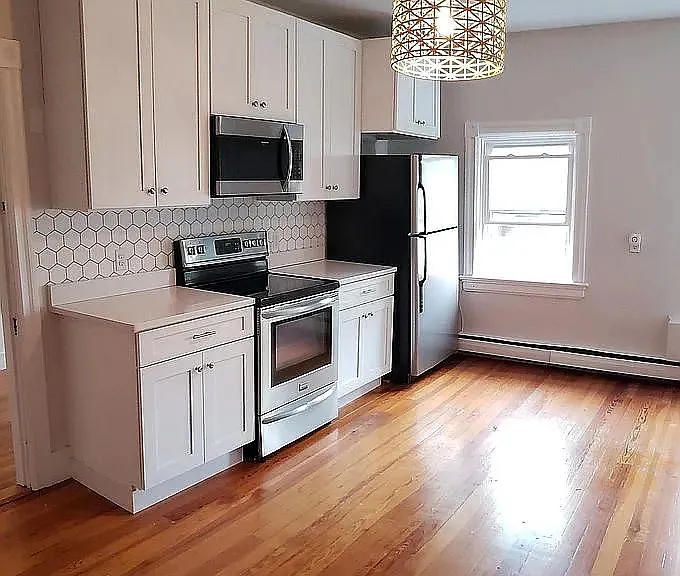 Kitchen stove, microwave, and fridge