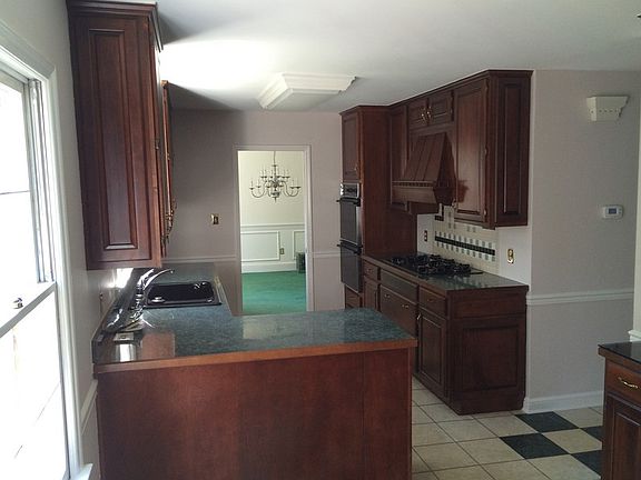 Kitchenette and kitchen, with easy access to dining room at far end.