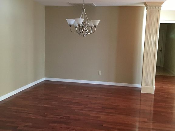 Open concept dining room with wood floors.