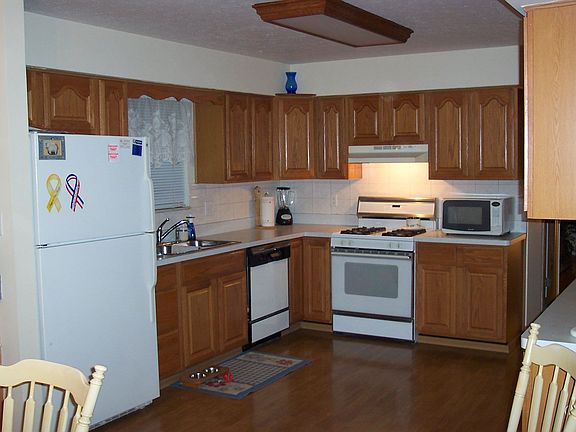 Beautiful updated kitchen with newer appliances, custom buffet with cabinets