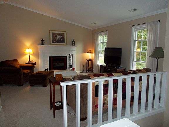 Spacious living room with vaulted ceiling & cozy FP