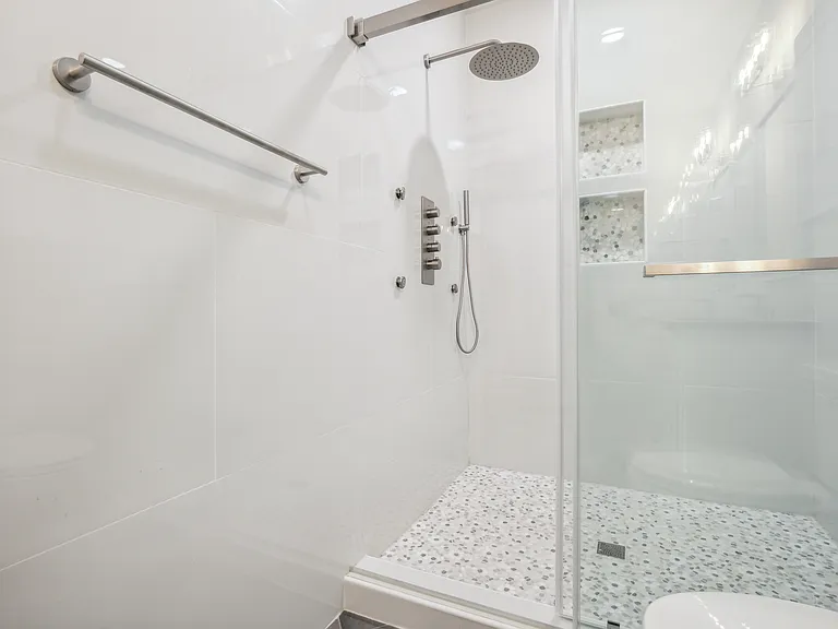 Floor to ceiling tiled walls.