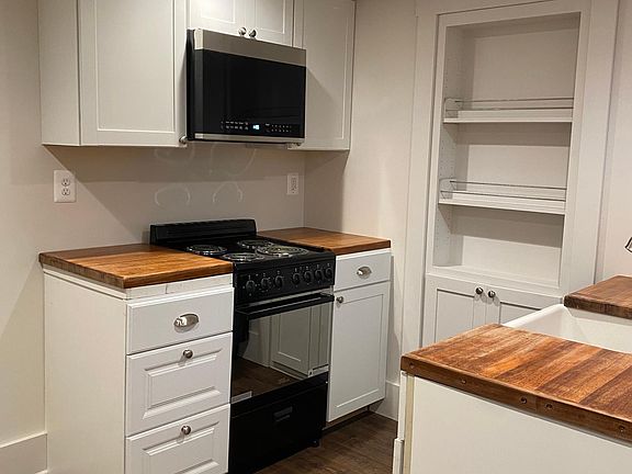 Kitchen - New appliances including new electric range and new microwave/hood as seen here