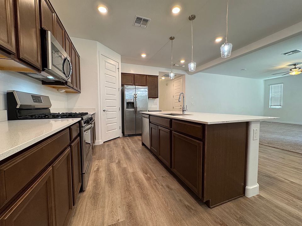 Chef Space. Gas range, large pantry and lots of granite countertop and cabinets