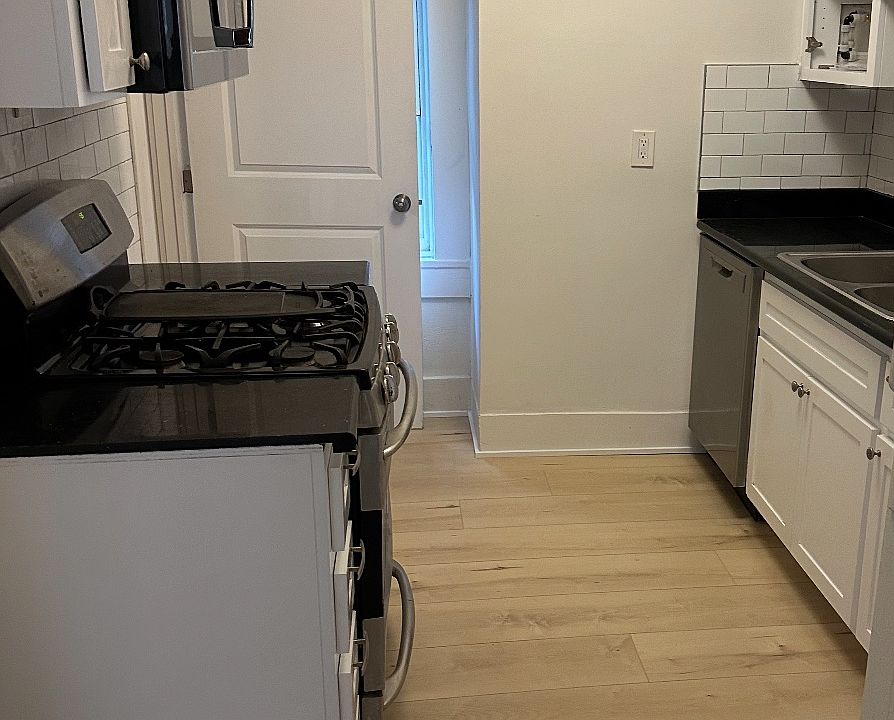 Bright galley kitchen with all new cabinets and stainless appliances.