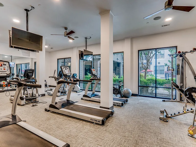 fitness center with cardio and weight equipment