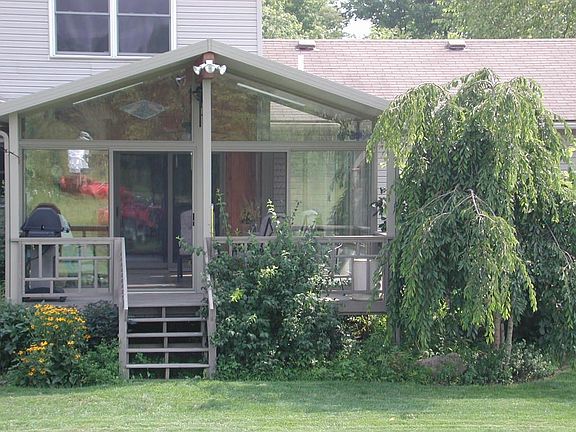 Great all-glass patio room with covered grilling deck