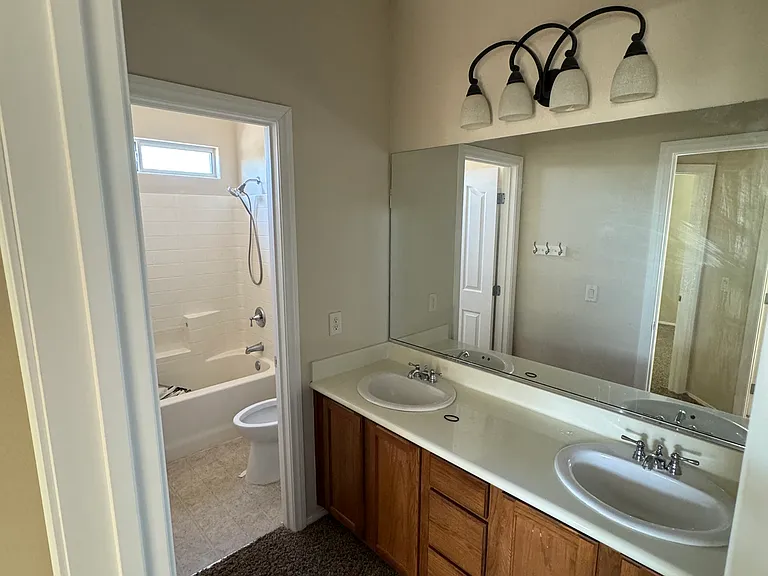Upstairs shared full bathroom with private shower