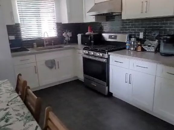 Kitchen (who what the possible set up would look like with a table for dining bumped up against the wall)