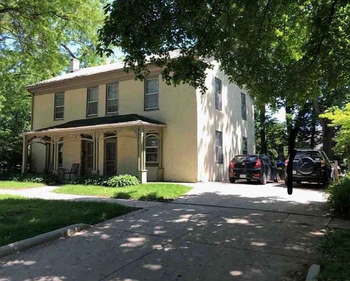 Front view from street. The side closest to the cars is the unit available