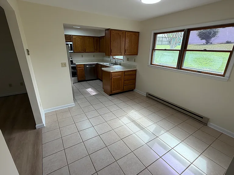 Separate dining room with this open floor plan offers lots of natural light