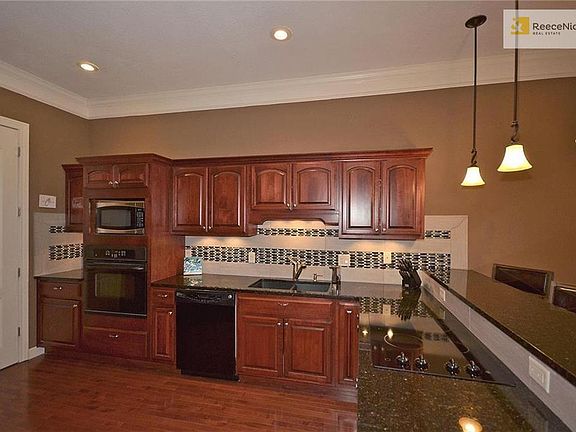 Updated kitchen with granite counters and new tile back-splash