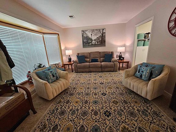 Living Room freshly painted with new carpet and large Bay window and window sill to enjoy the view and loads of natural light.