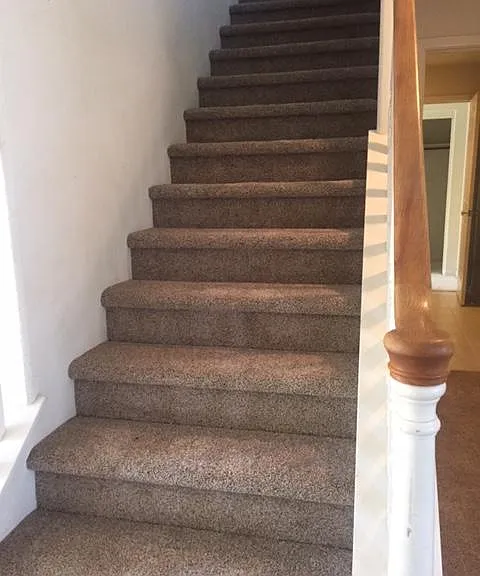 Staircase, the master bedroom is the first left and another bedroom is on the second left next to the master bedroom
