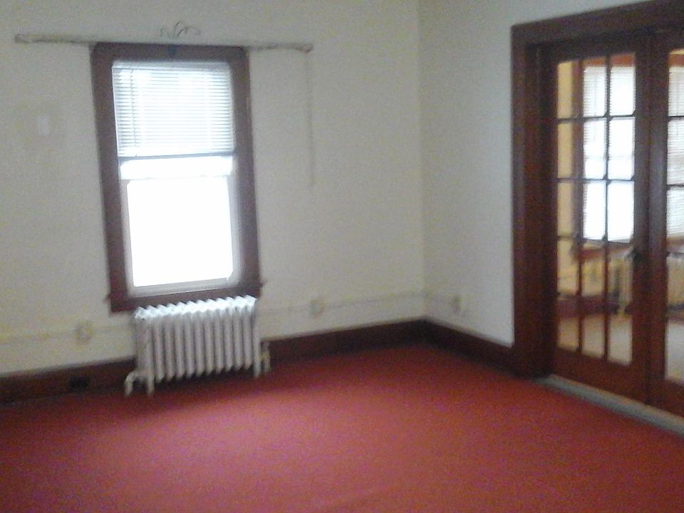 Living room with French doors to dining area.