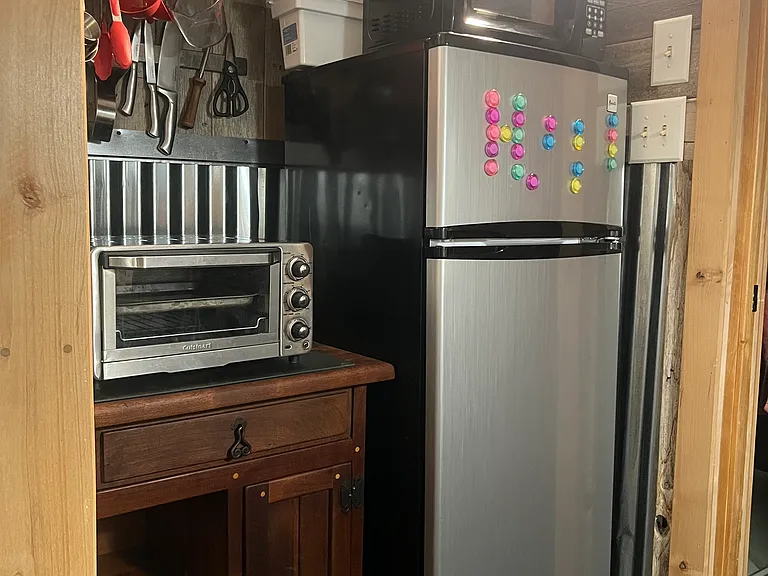 Full size apartment fridge, microwave, and toaster oven.