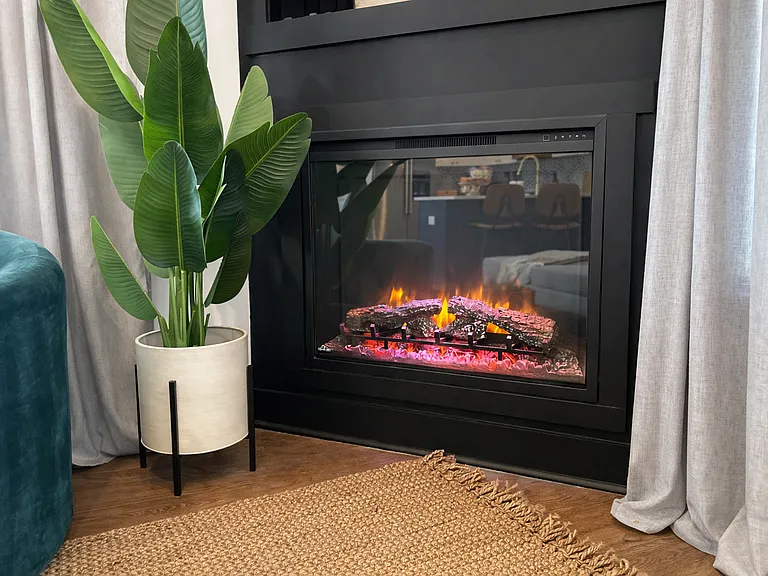 Beautiful gas fireplace in the living room sets the mood and creates the ultimate relaxation setting.