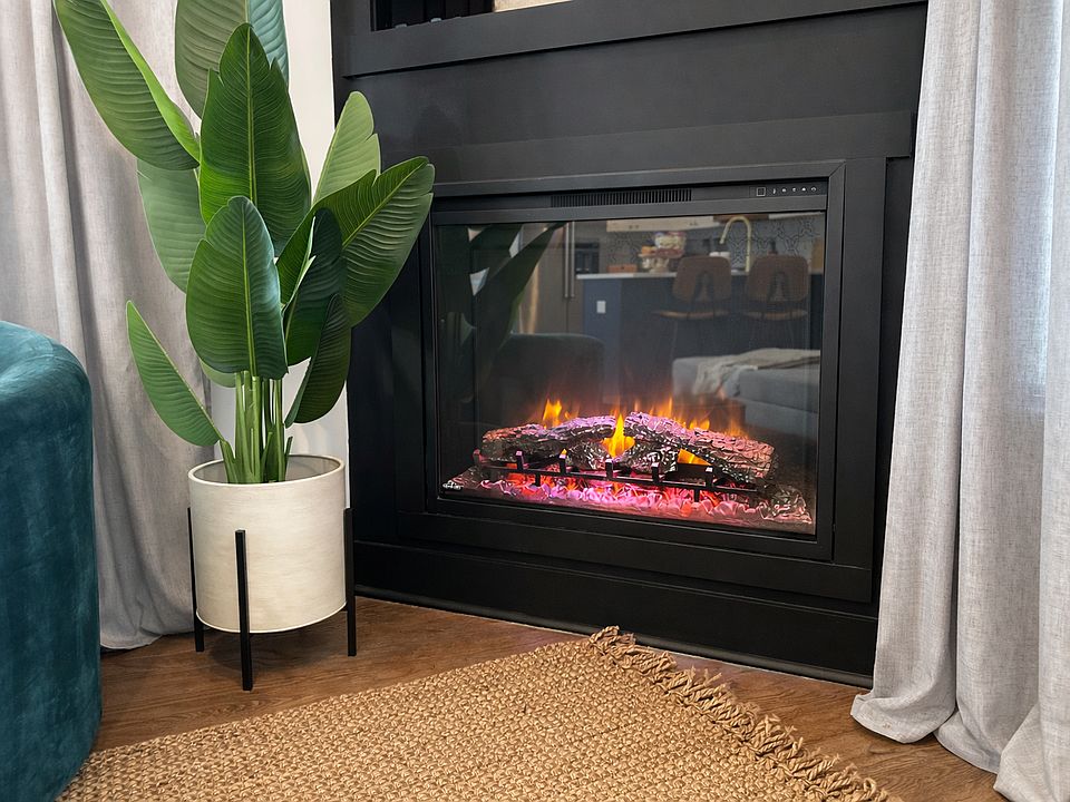 Beautiful gas fireplace in the living room sets the mood and creates the ultimate relaxation setting.