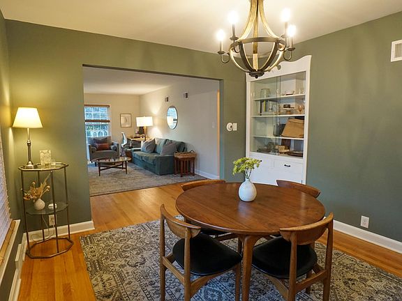 Stunning dining room flows into inviting living room.