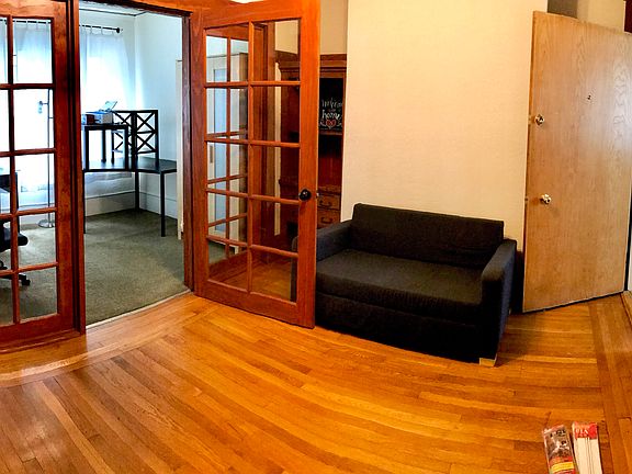 Partial view of Living room, French door open to smaller bedroom