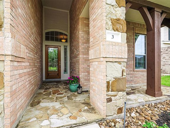 Beautiful Porch accented with Stone to Welcome Your Guests