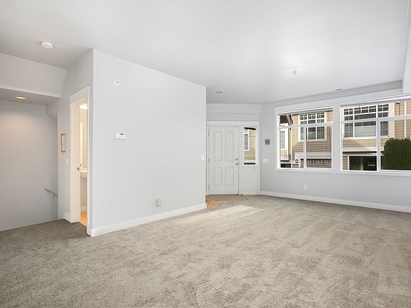 Entry way leads to a big living/family room.