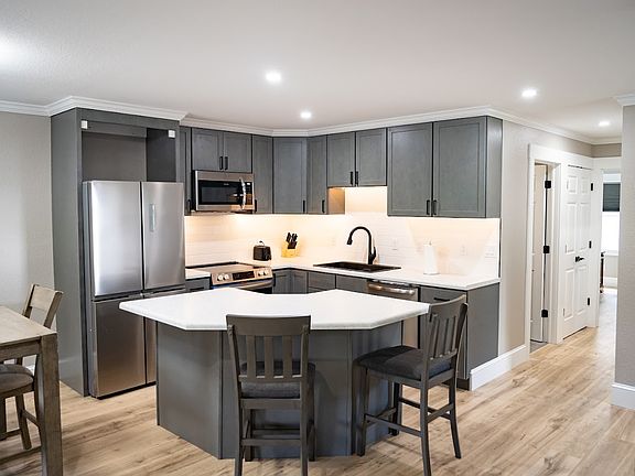 Kitchen with hallway to bathroom and bedrooms