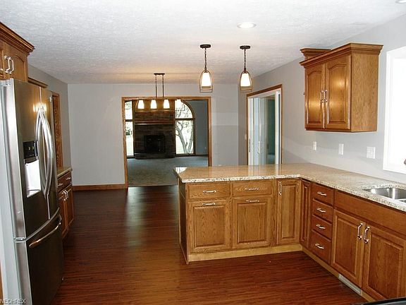 New granite counters. View into the great room from breakfast bar